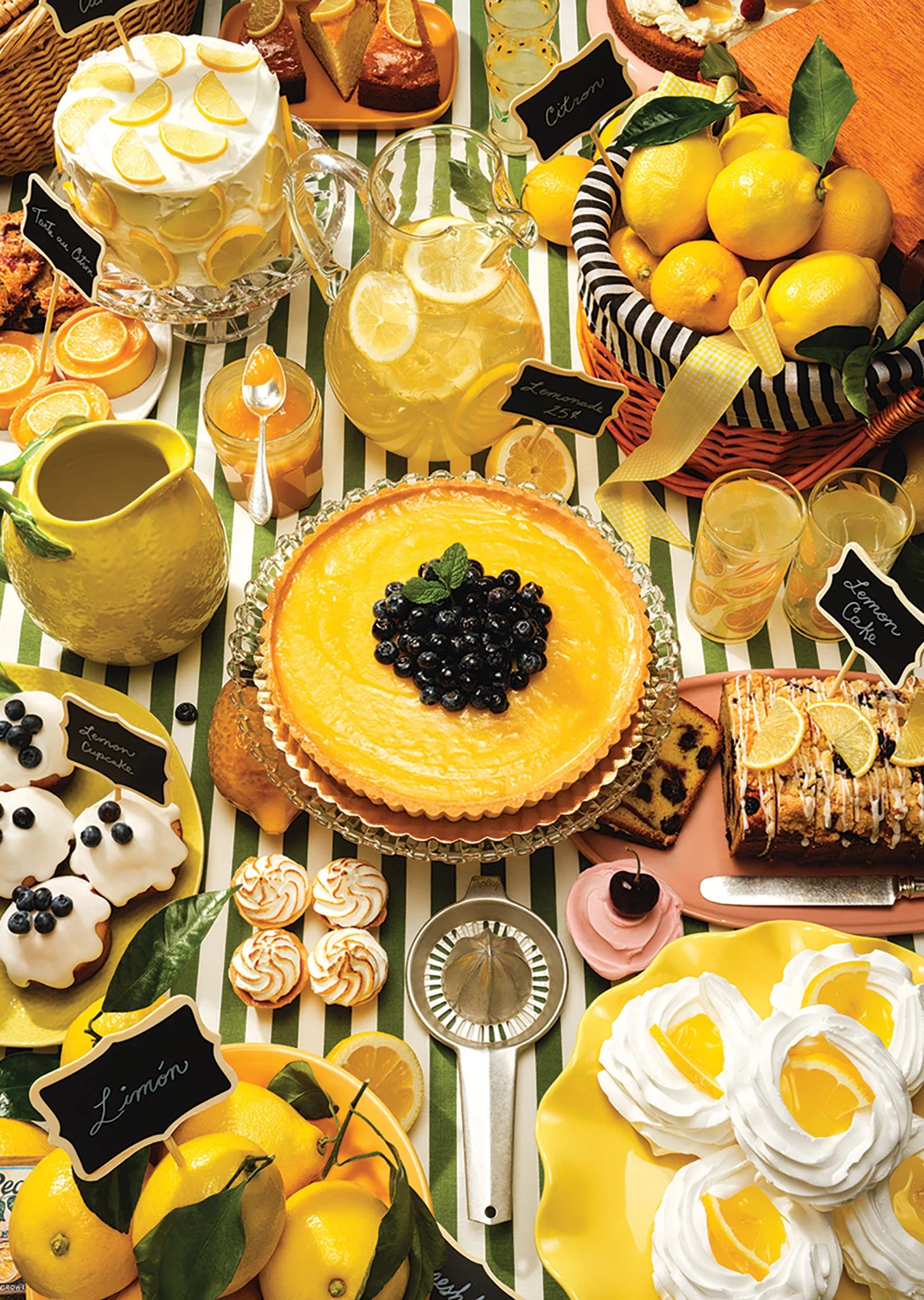 Table with lemon-themed desserts and drinks, including a lemon tart and lemonade.