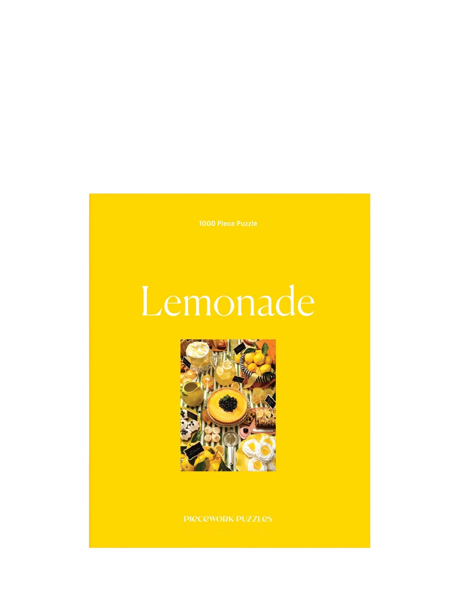 Yellow puzzle box with 'Lemonade' text and a colorful illustration on a light purple background