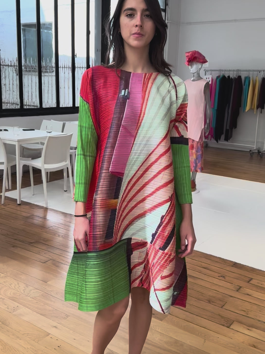 Pleats please by Issey Miayke tunic dress in multicolour print swings nicely when model moves around.
