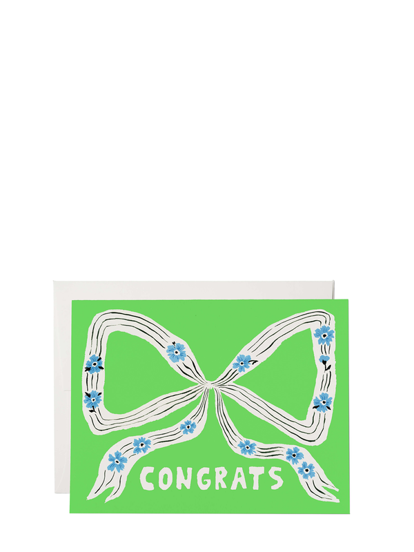 Greeting card with a green background featuring a white ribbon with blue flowers and the word 'CONGRATS' in bold letters. It comes with a white envelope.
