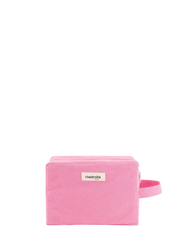A pink rectangular zippered cavas pouch with a matching pink wrist strap and a small white label reading 'rivedroite Paris' on the front, set against a plain white background.