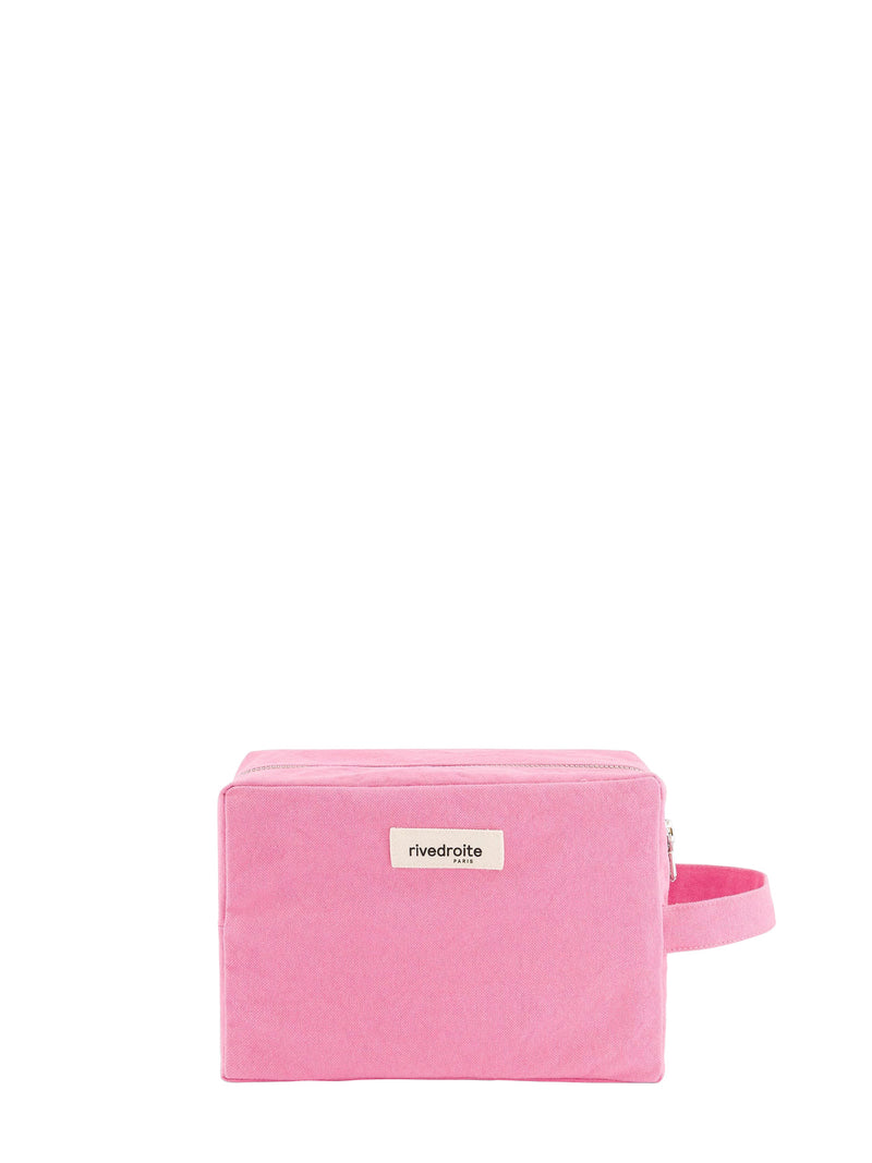 A pink rectangular zippered cavas pouch with a matching pink wrist strap and a small white label reading 'rivedroite Paris' on the front, set against a plain white background.