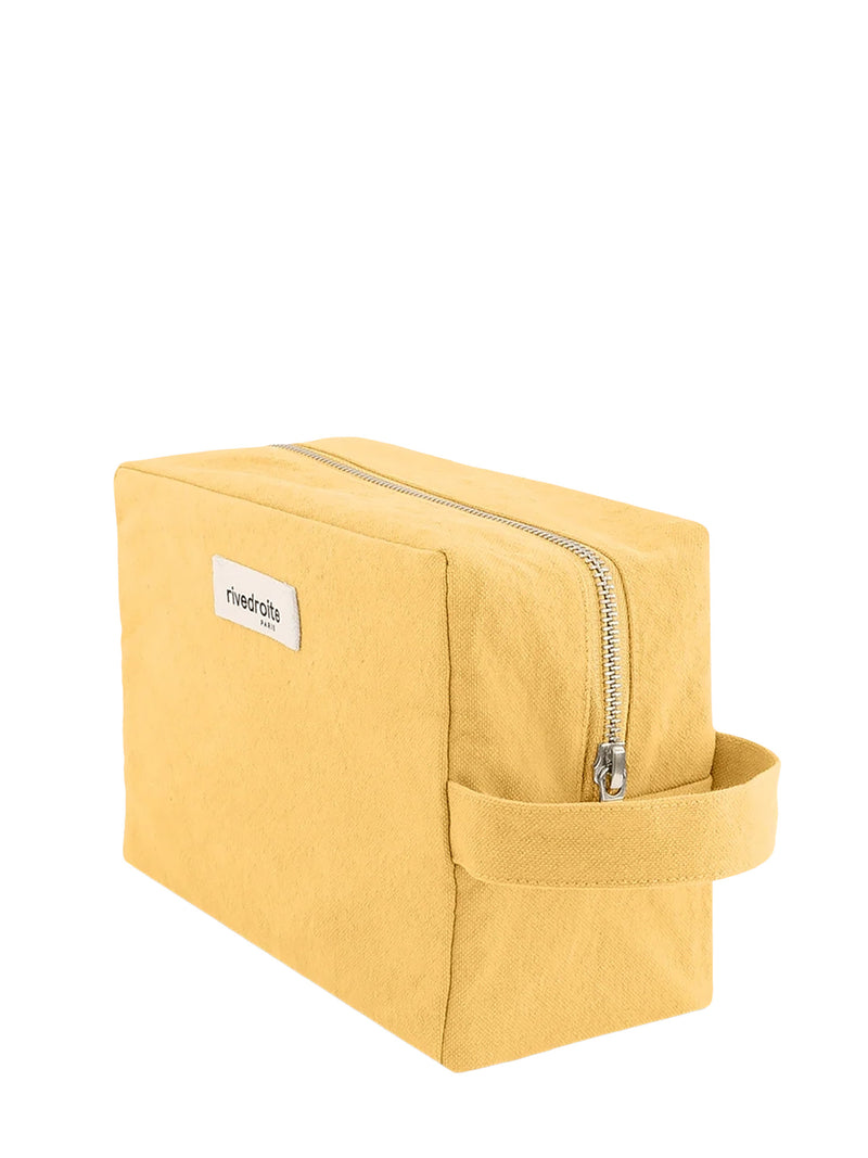 A yellow canvas zippered pouch with a side loop handle and a small white brand label, shown on a plain white background.
