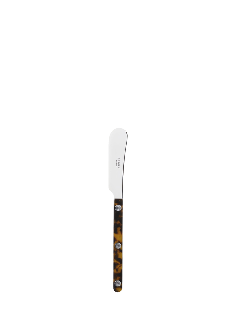 A stainless steel butter knife with a faux tortoise shell pattern handle.