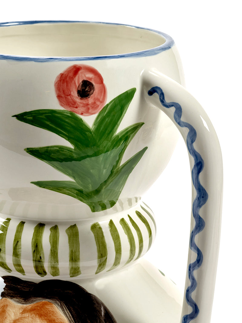 Ceramic vase with floral design on a white background