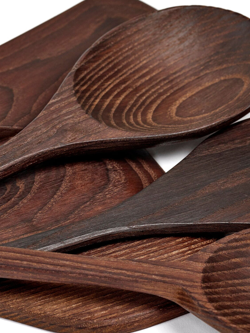 Set of wooden spoons with a wenge finish on a white background