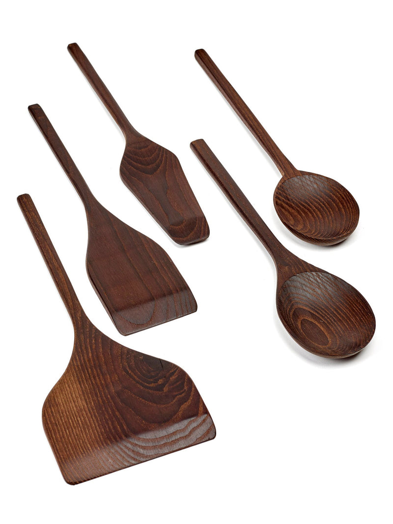 Set of wooden kitchen utensils including spoons and spatulas on a white background