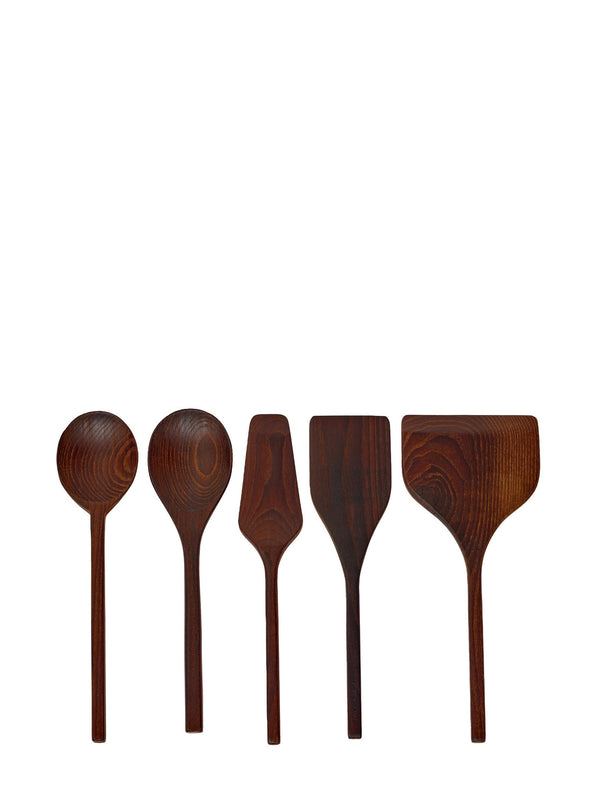 Set of five wooden kitchen utensils on a white background