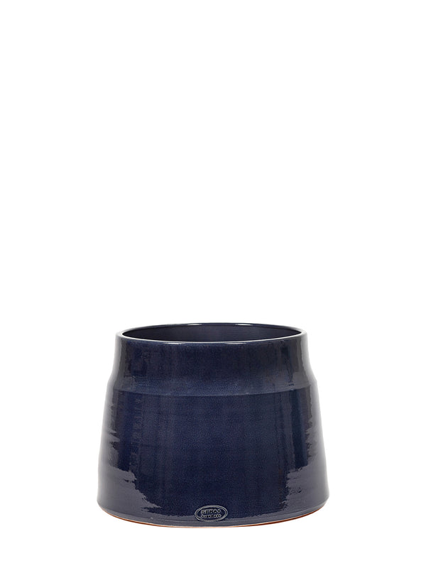 A dark navy blue glazed ceramic planter pot with a subtle conical shape and a small circular logo near the base, set against a solid white background.