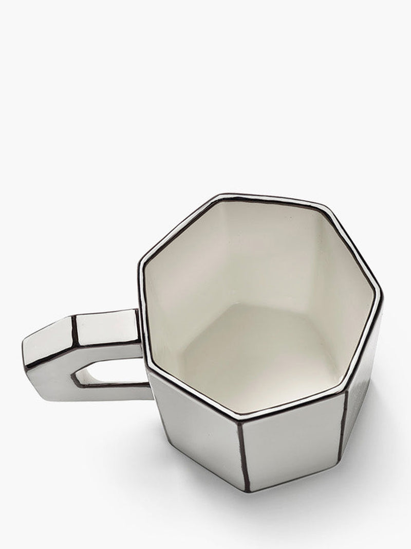 White-black geometric cup on a white background