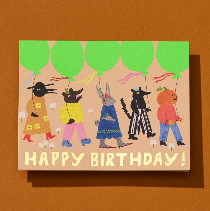 Birthday card with animal characters holding balloons on a brown background