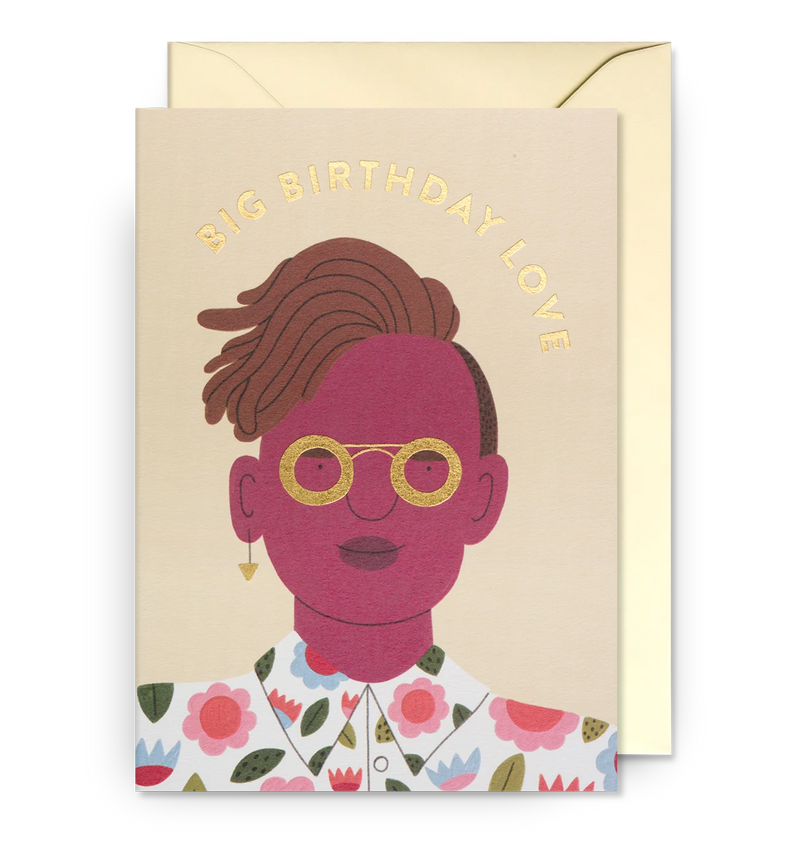 Illustrated birthday card with a female figure wearing glasses and a floral dress, accompanied by the text 'BIG BIRTHDAY LOVE' at the top, against a beige background. A matching envelope is visible to the side.