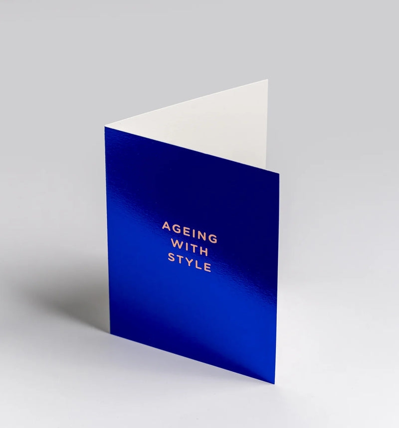 Blue greeting card with 'Ageing with Style' text on a gray background