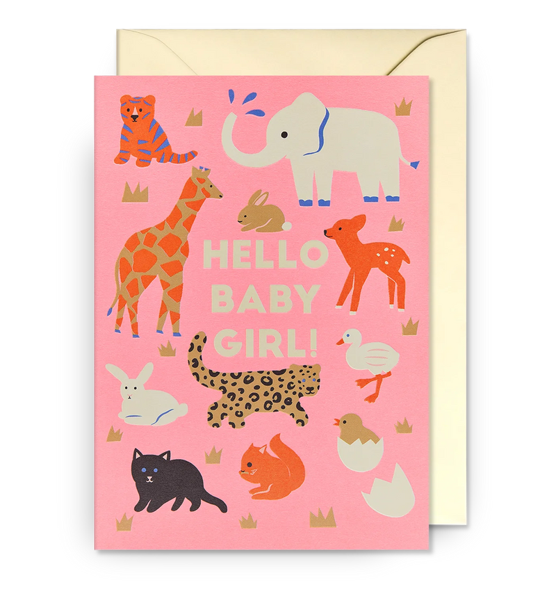 A pink greeting card with various animal illustrations and the text 'HELLO BABY GIRL!' at the center. There is a matching envelope behind it.