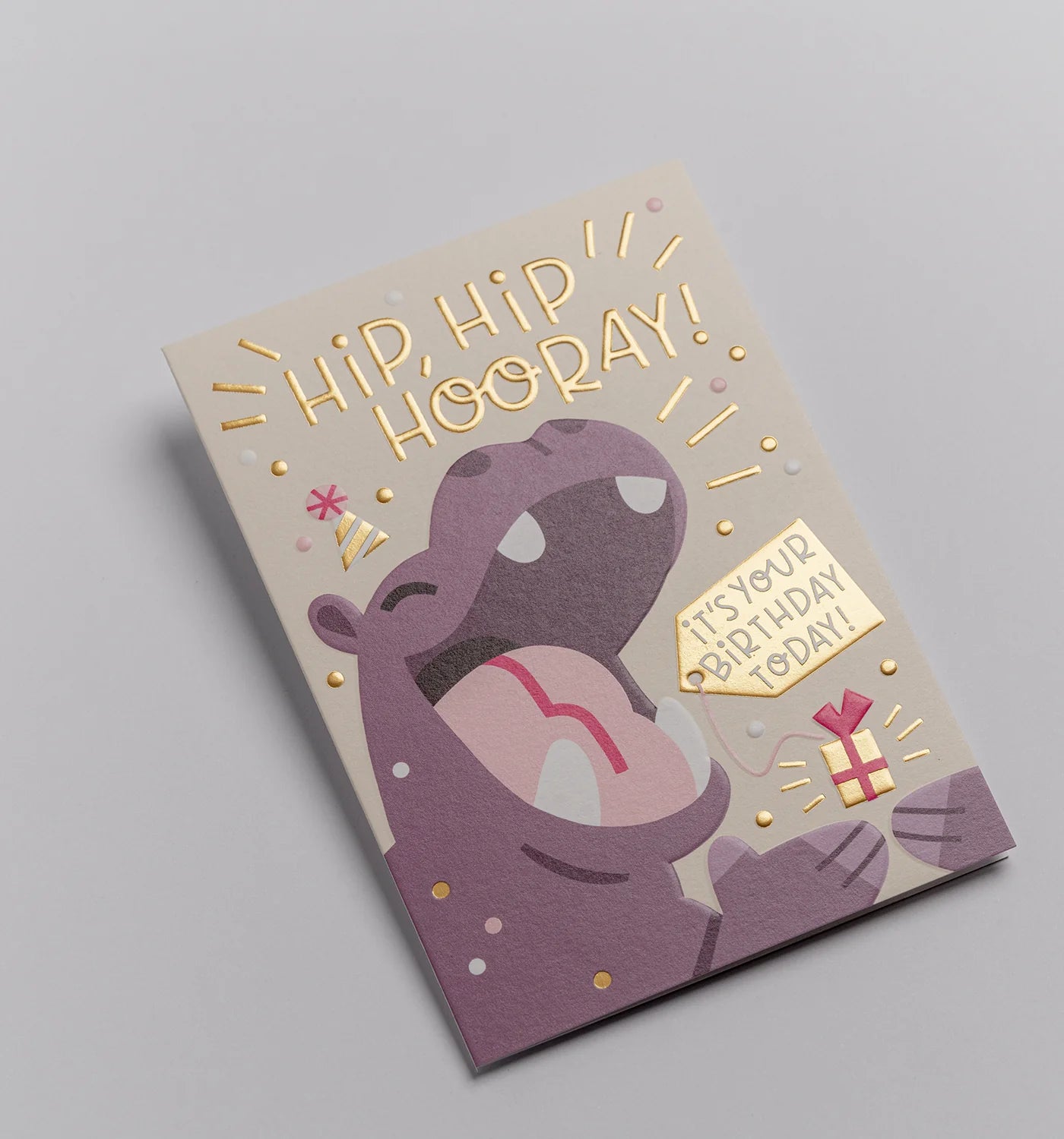 Birthday card with a hippo illustration and celebratory text on a gray background