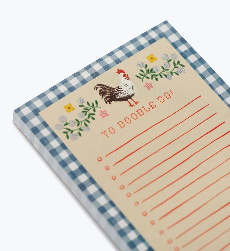 Notepad with a chicken illustration and checkered border on a white background