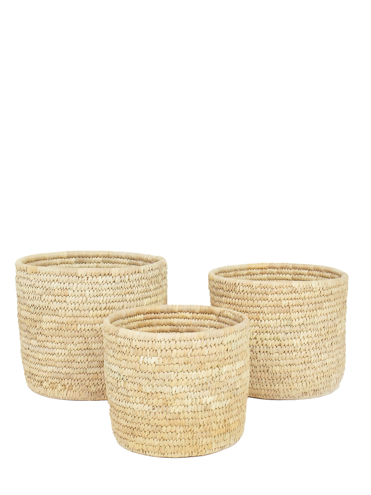 Three beige palm cylinder pots of varying sizes arranged in a visually appealing manner, likely intended for home decor use.
