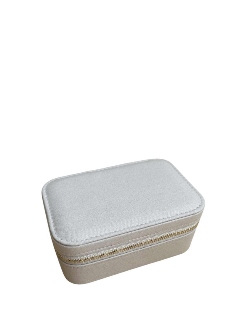 Small rectangular jewelry box with a zipper on a white background