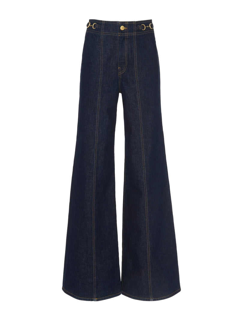 Pair of dark blue wide-leg jeans on a white background
