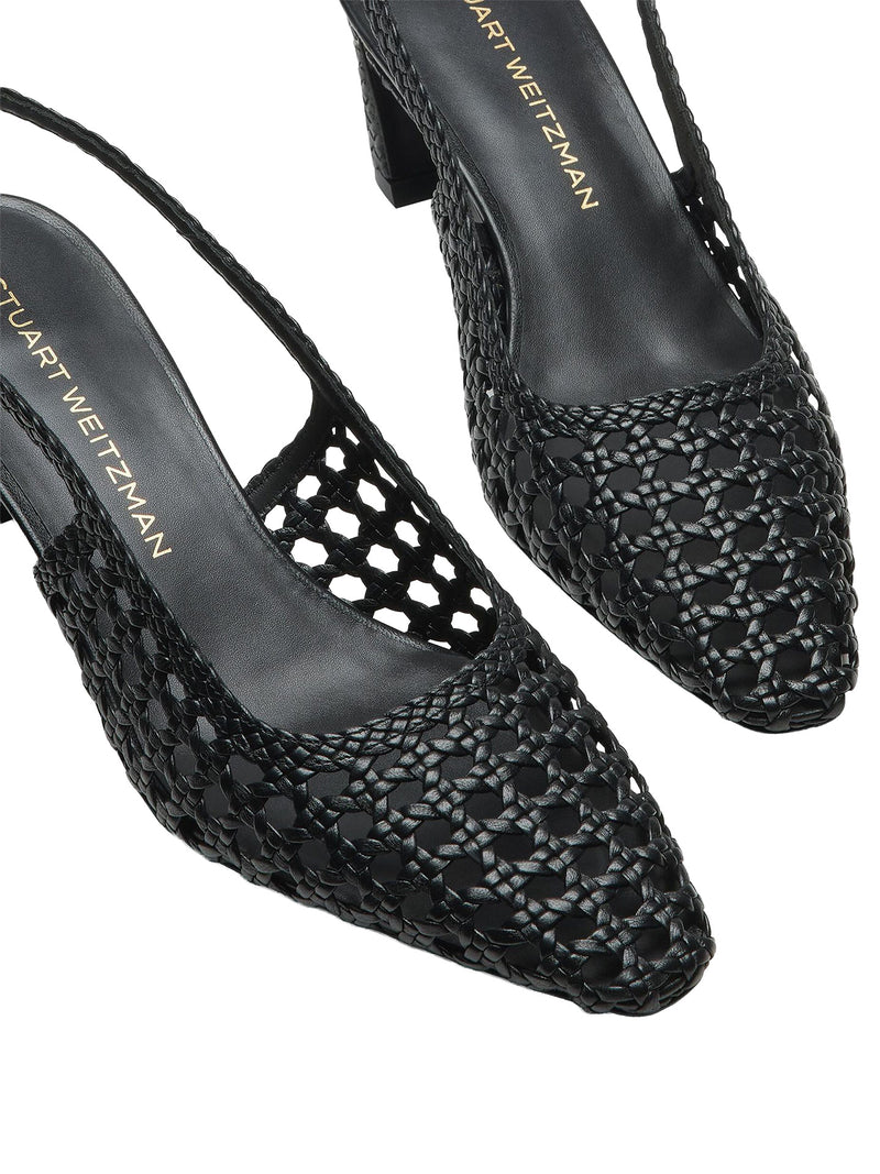 Black woven high-heeled shoes with 'Stuart Weitzman' branding on a white background