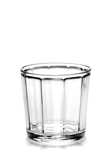 A clear glass from the Surface glassware collection by Sergio Herman, with a smooth surface and ribbed interior.
