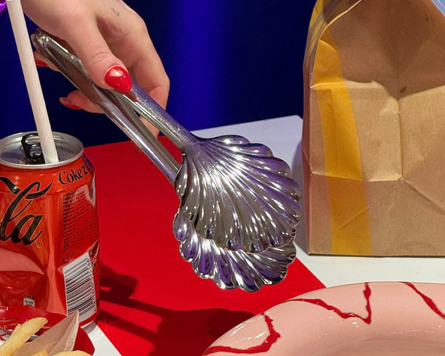 Shell-shaped salad tongs by Roger Orfevre