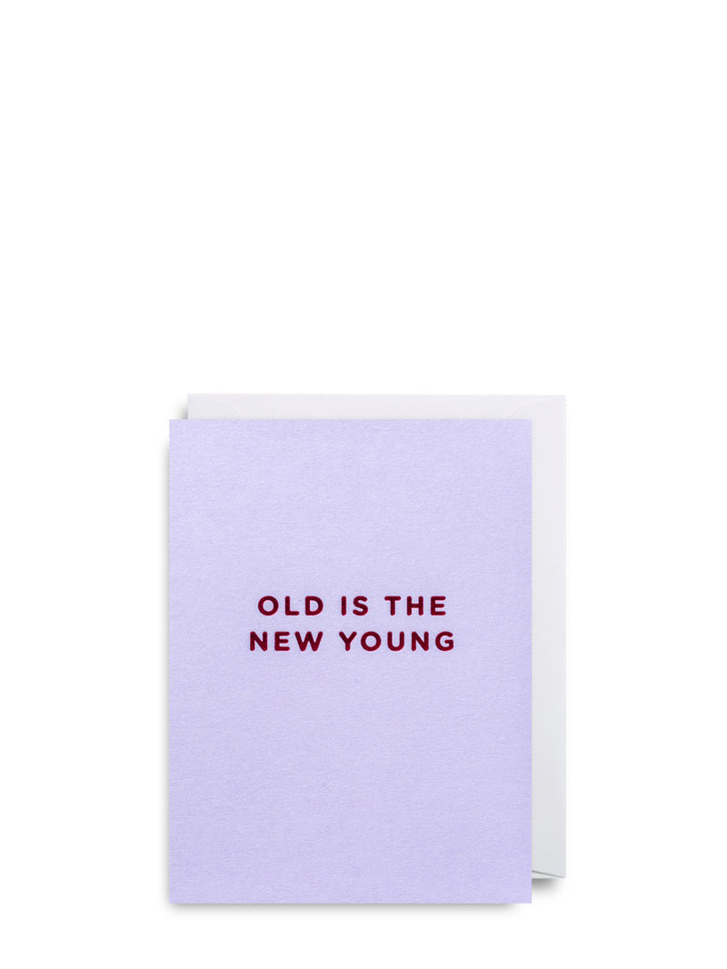A solid lavender lilac mini greeting card with the text 'OLD IS THE NEW YOUNG' printed in burgundy red.