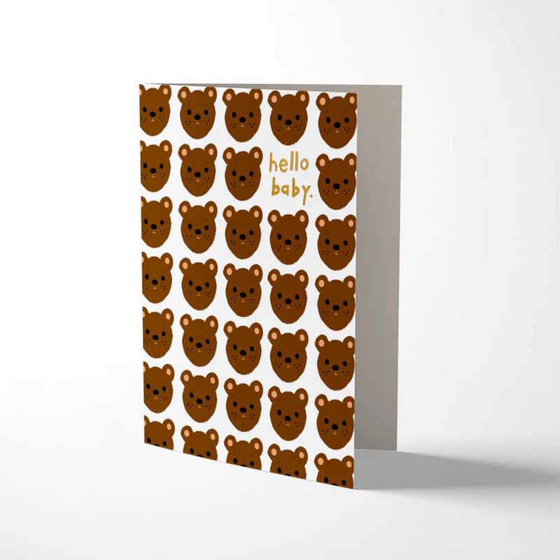Greeting card with brown bear pattern and 'hello baby' text on a white background