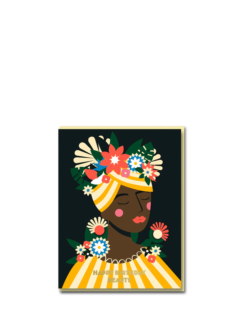 Birthday card featuring a woman with flowers in her hair on a dark background