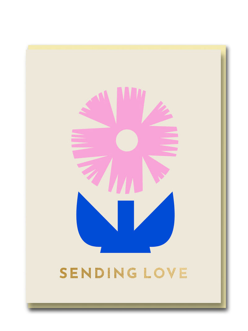Card with pink flower and blue leaf design on a beige background