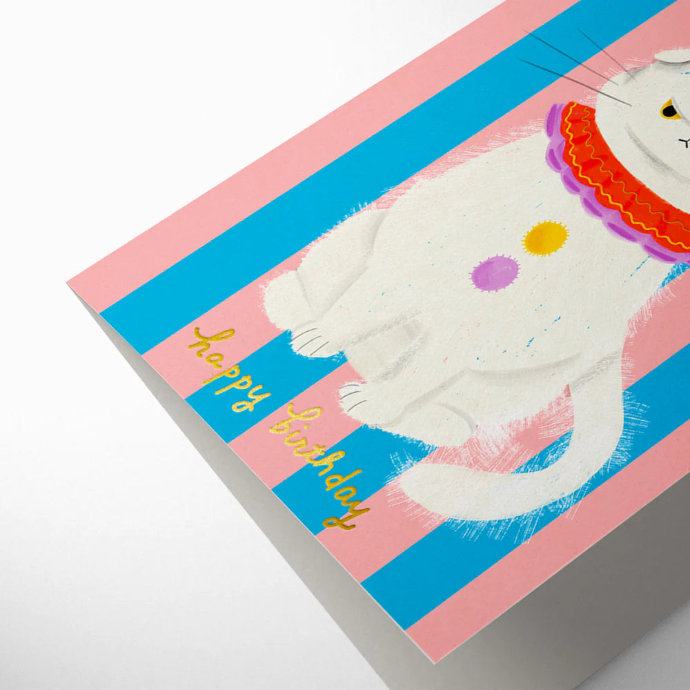 Greeting card with a cat illustration and 'Happy Birthday' text on a pink and blue striped background.