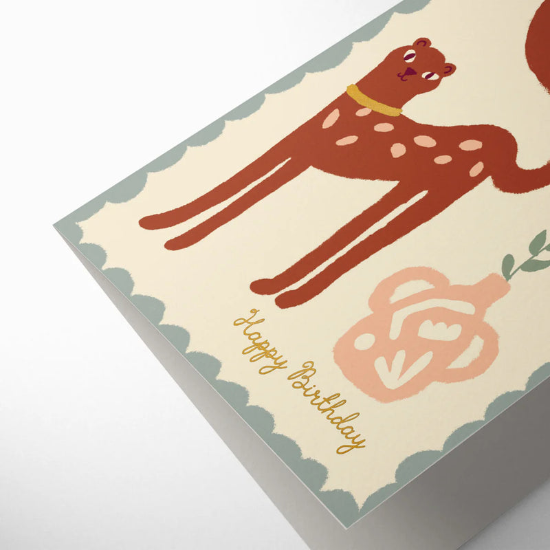 Birthday card with a deer illustration and 'Happy Birthday' text on a beige background