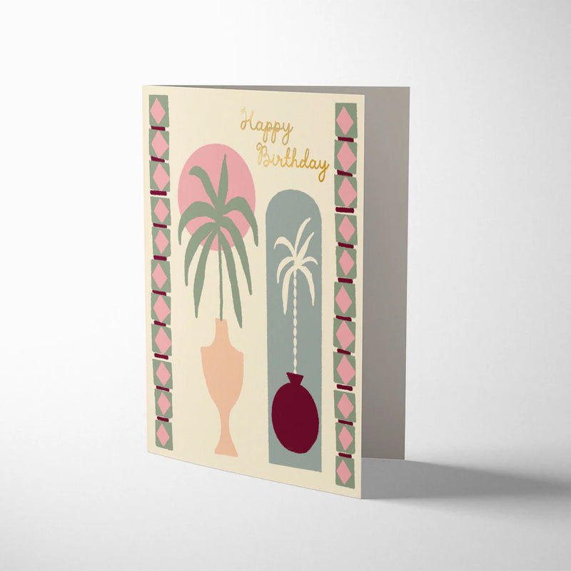 Greeting card with palm tree design and 'Happy Birthday' text on a white background