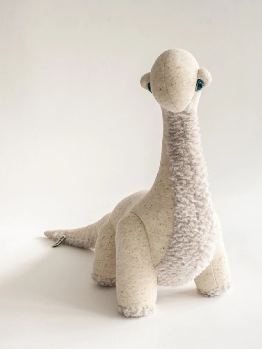 The Small Ivory Dinosaur Stuffed Animal