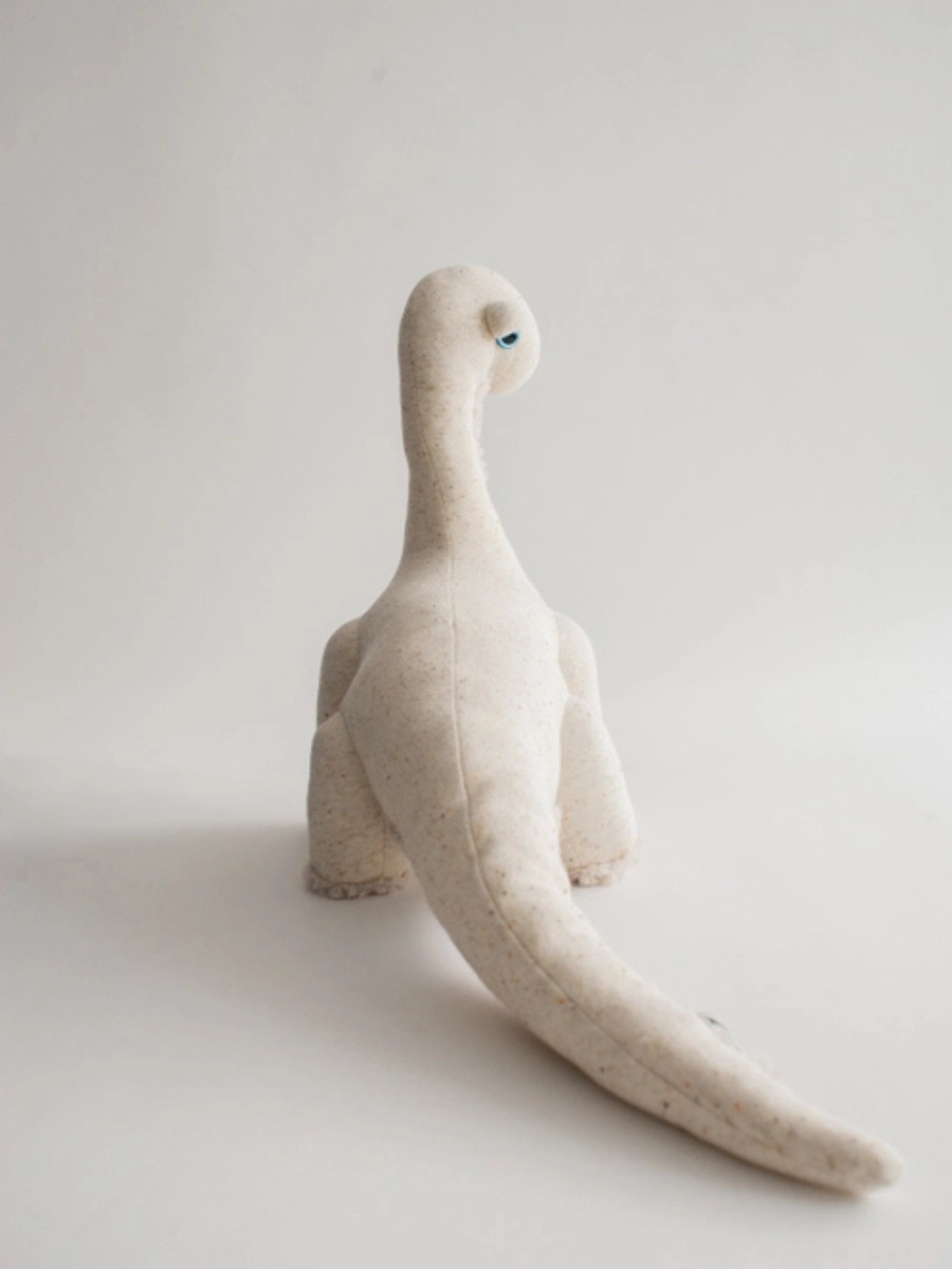 The Small Ivory Dinosaur Stuffed Animal