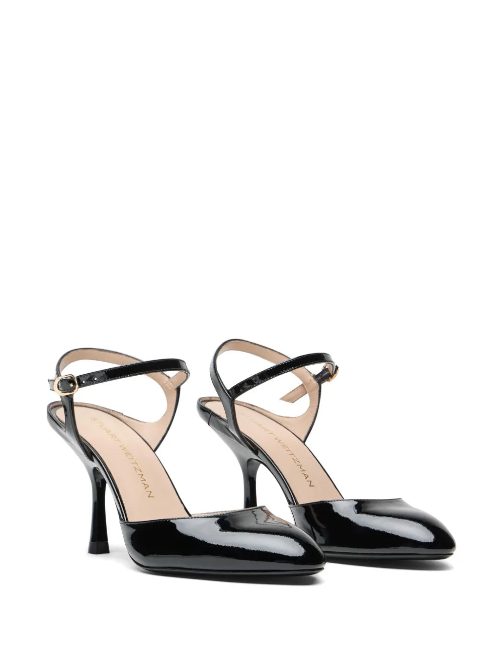 Pair of black high-heeled shoes with thin straps on a white background