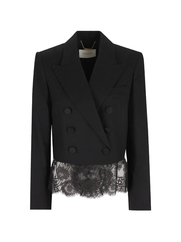 A black double-breasted blazer with structured shoulders and a sheer black lace ruffle hem, displayed on a clean white background.