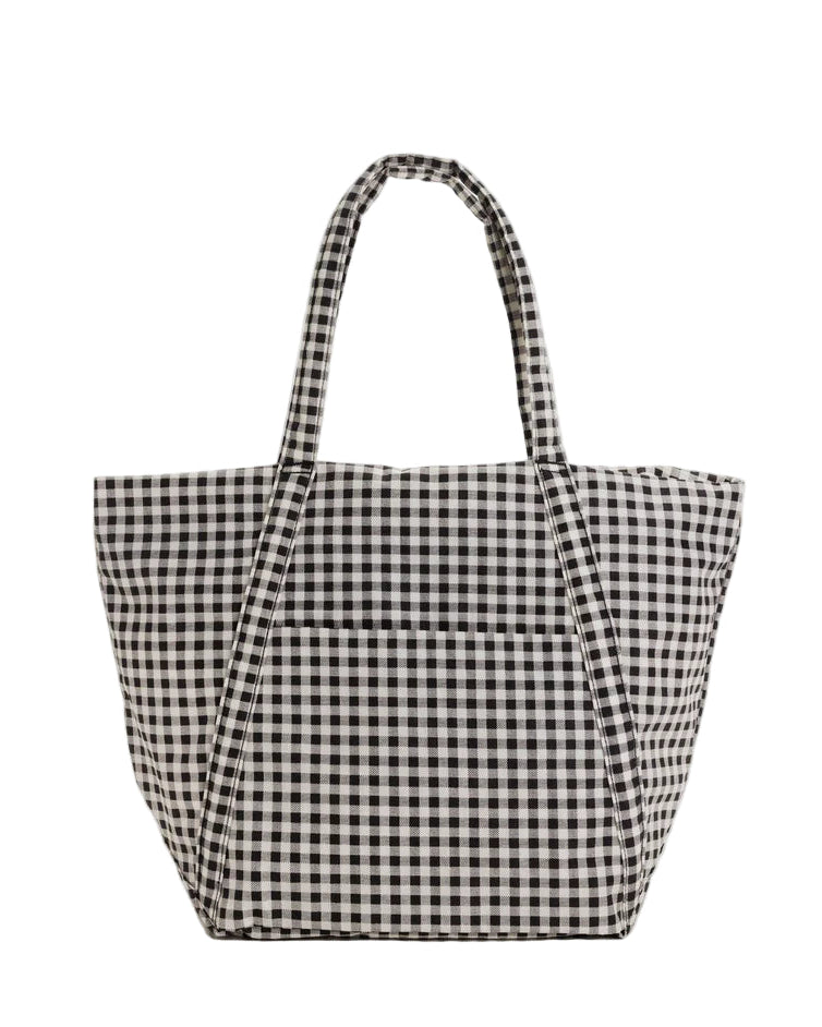 Black and white checkered tote bag on a light gray background