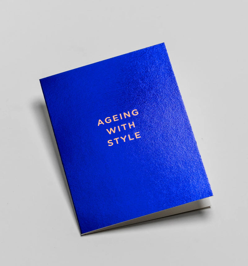 Blue greeting card with 'Ageing with Style' text on a gray background