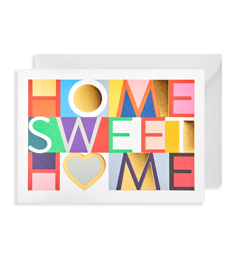 A colorful greeting card with the text 'HOME SWEET HOME' in various colors, presented with an envelope.