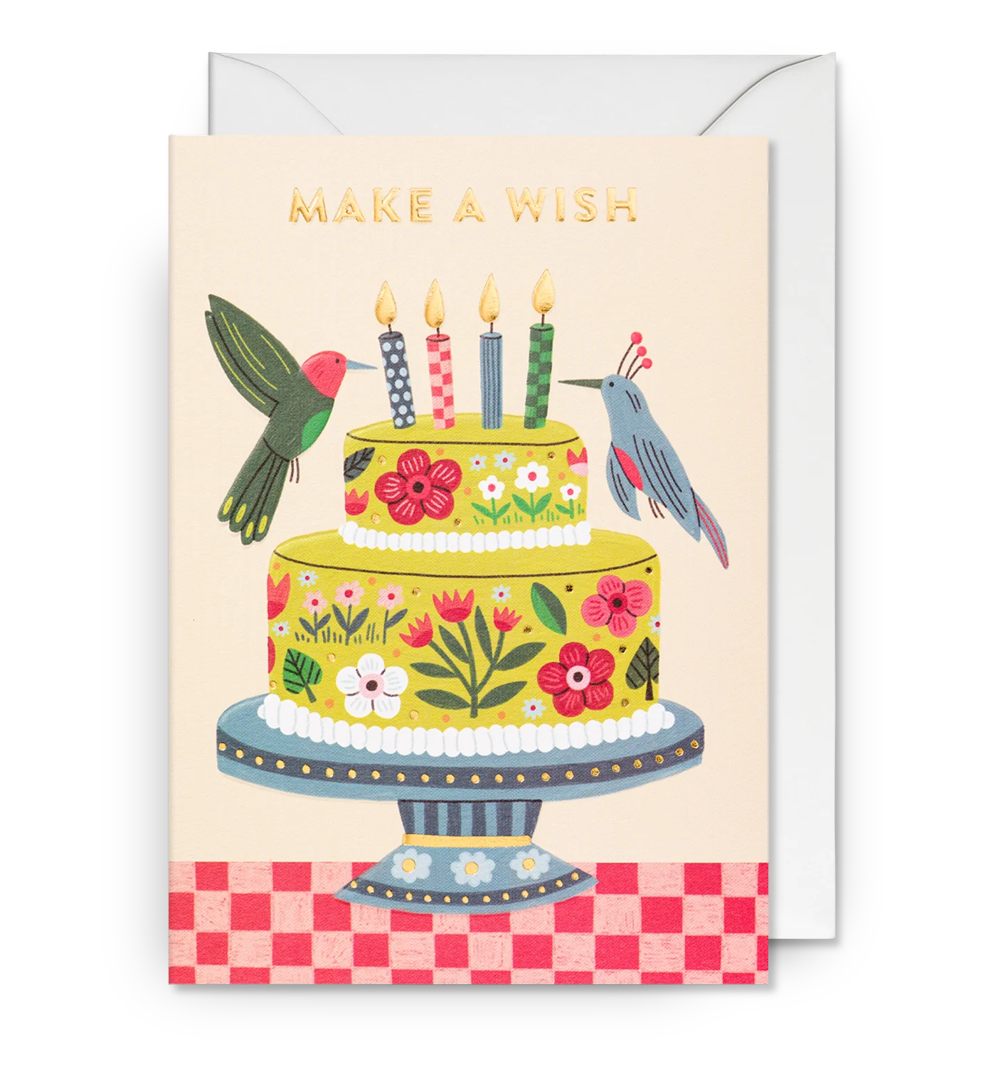 Illustrated birthday cake greeting card with birds, flowers, and 'MAKE A WISH' text on top. The card is shown with its matching envelope.