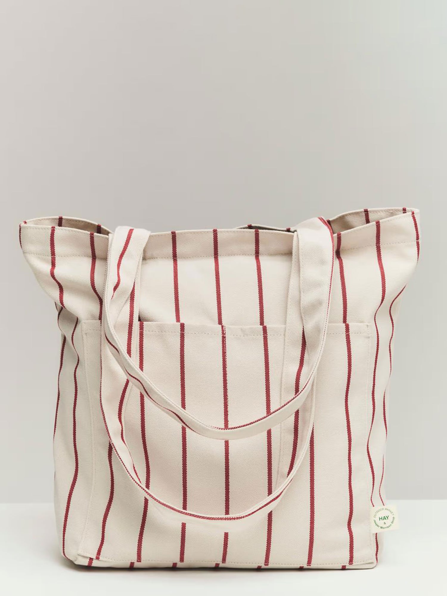 Tote bag with red vertical stripes on a white background