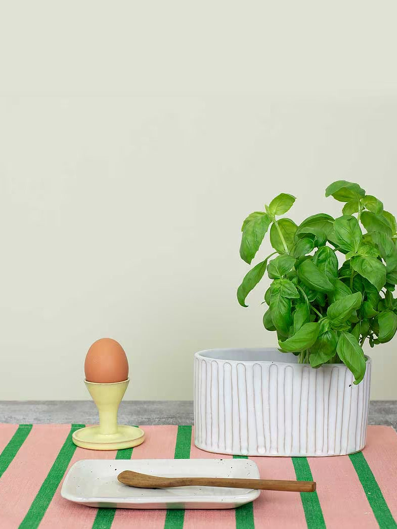 Atlas ceramic eggcup, yellow