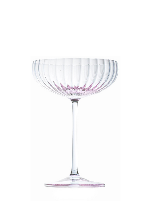 A mouth-blown lilac champagne glass with a rippled pattern, stem included, displayed against a white background.