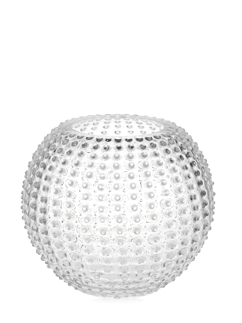 A crystal clear, round glass vase with a hobnail pattern.