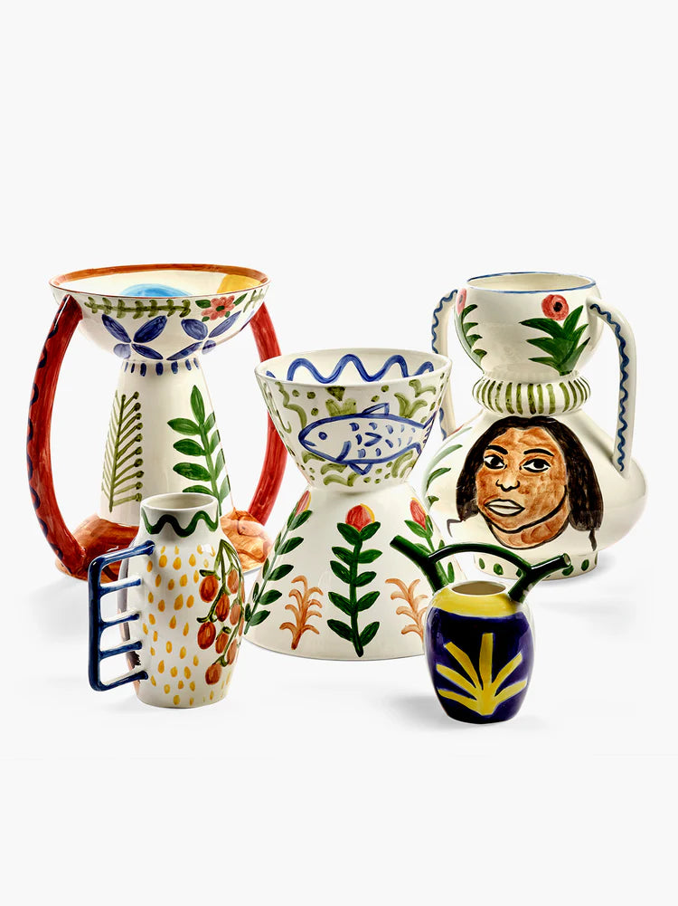 Set of colorful ceramic vases with various designs on a white background