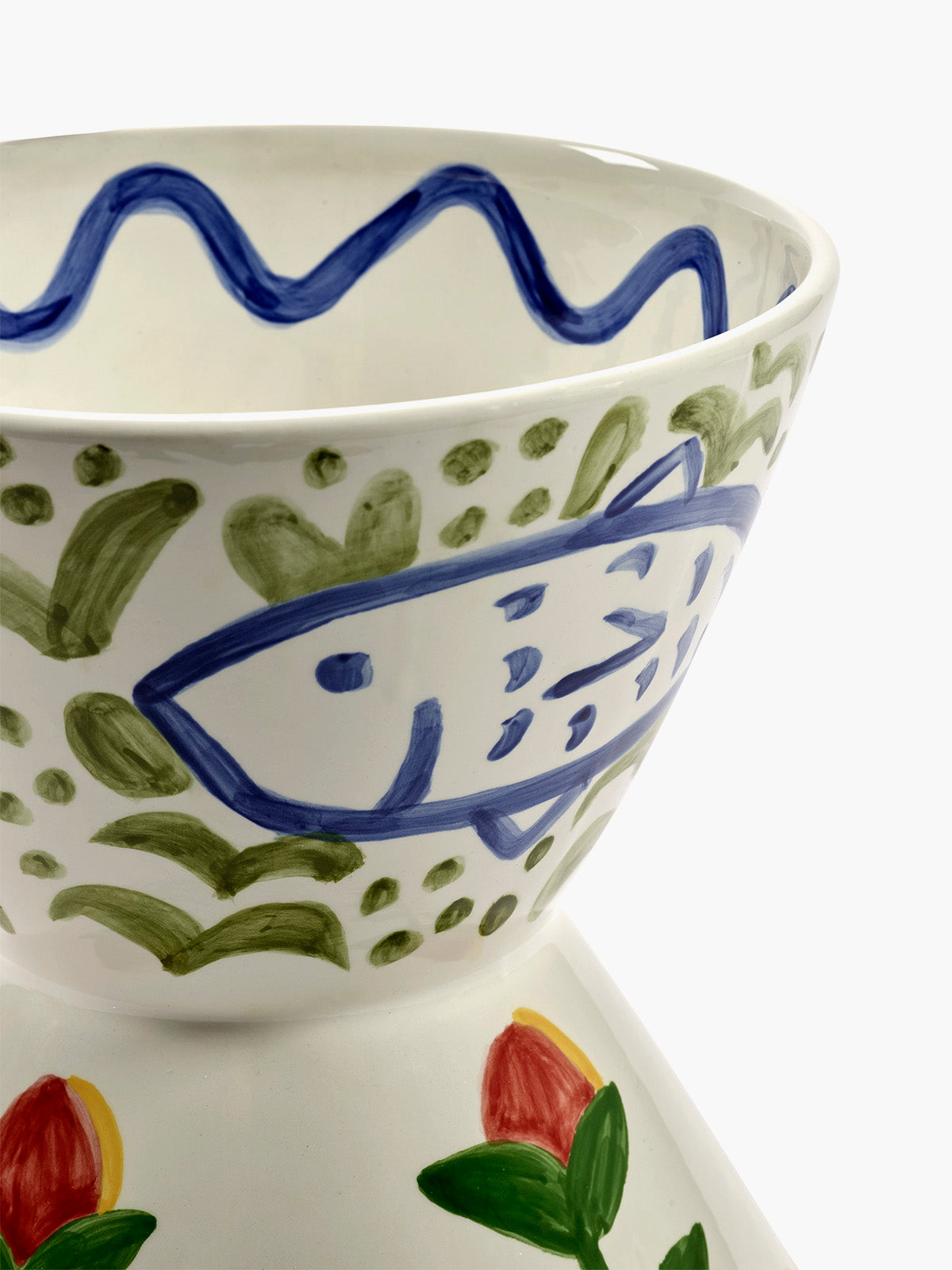 Ceramic bowl with fish design on a white background