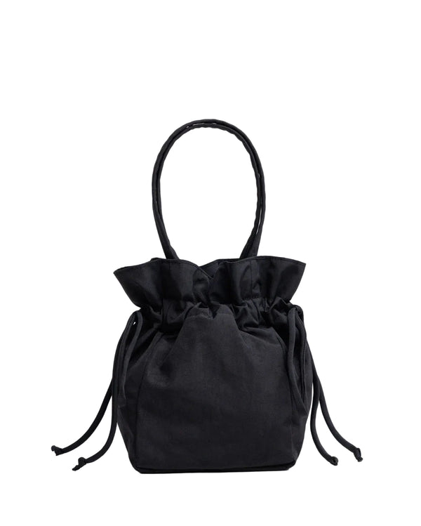 Black drawstring bag on a light gray background
