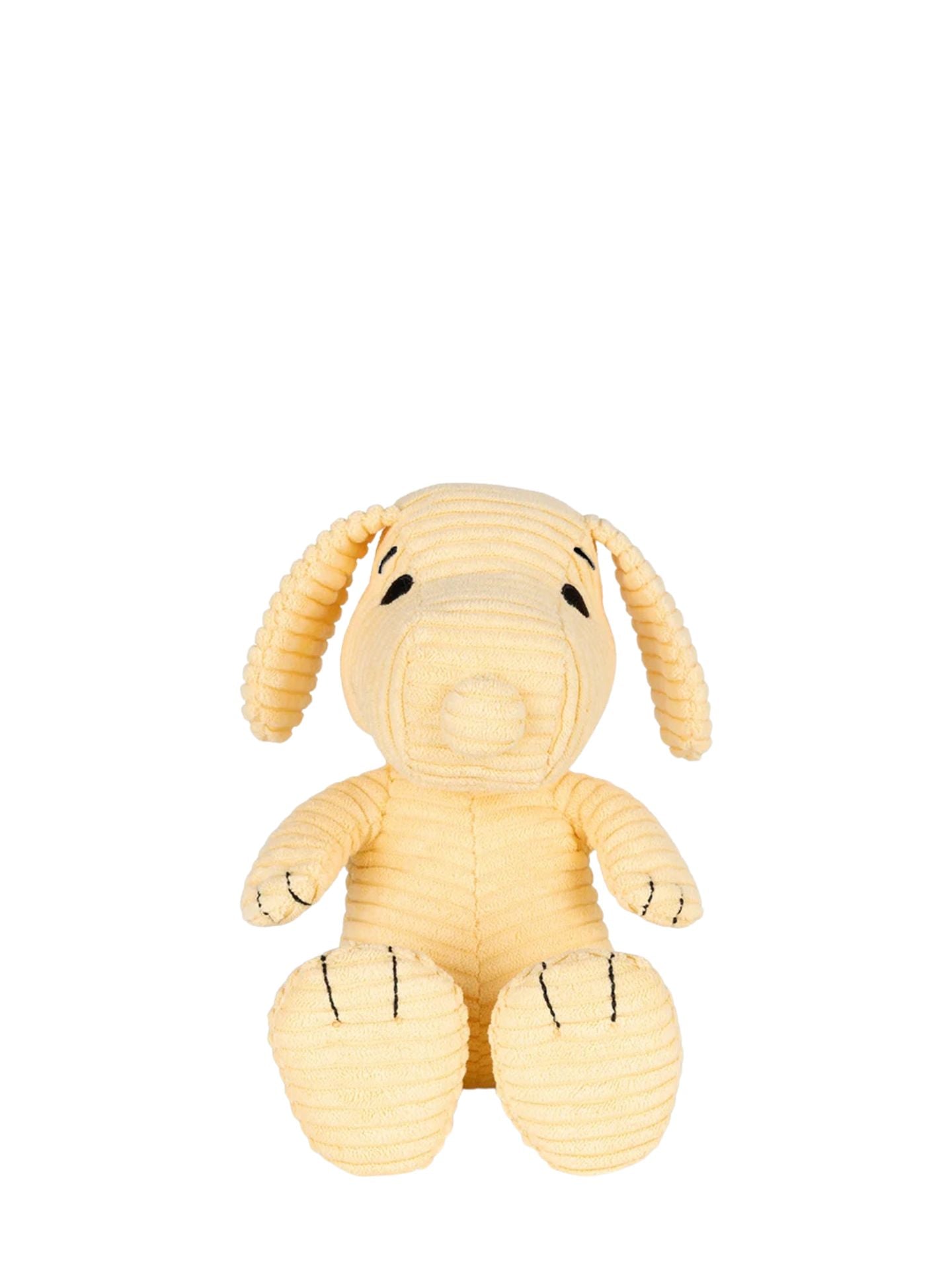 Yellow plush dog toy on a white background