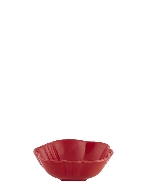 A small red earthenware bowl shaped like a halved tomato, on a white background.